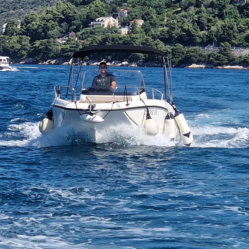 Speedboat charter Dubrovnik cruising past city walls